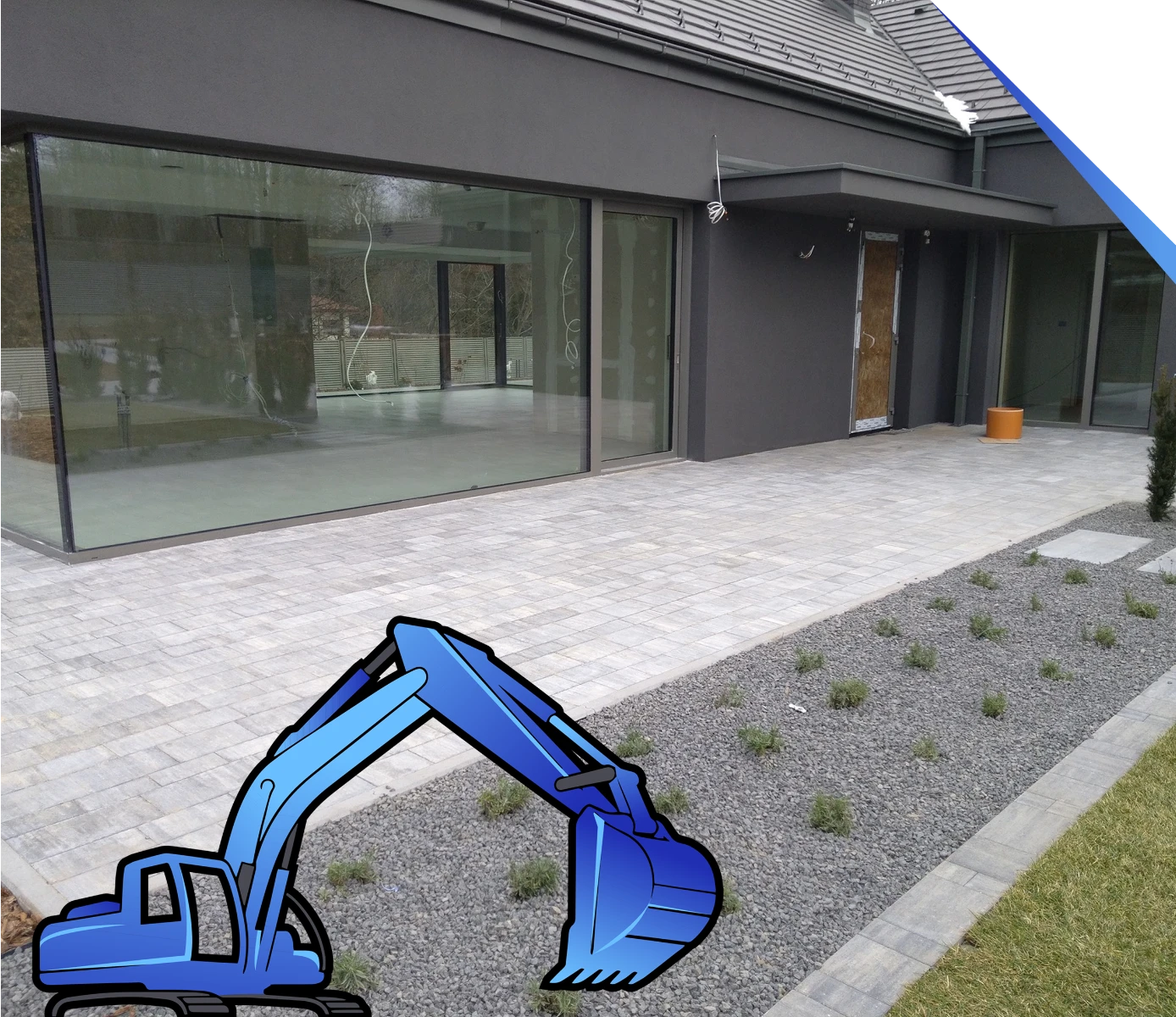 Taras przy nowoczesnym budynku wyłożony szarą kostką brukową z rysunkową koparką reprezentującą Układanie kostki brukowej